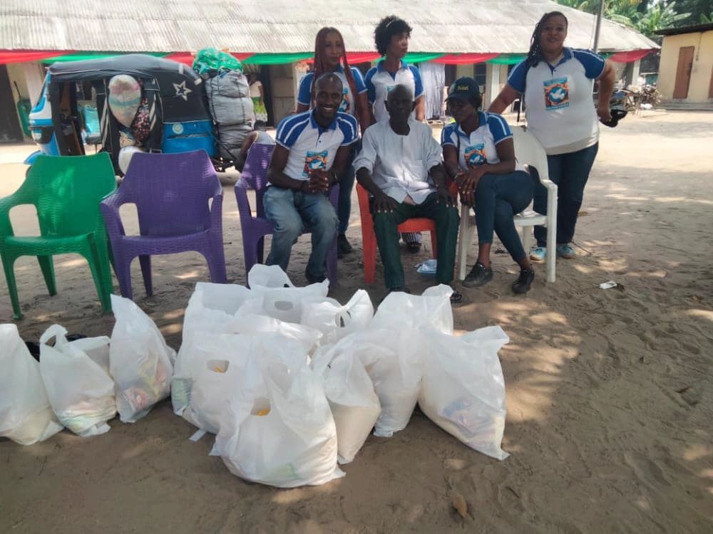 TCV volunteers preparing bags of essential supplies for families
